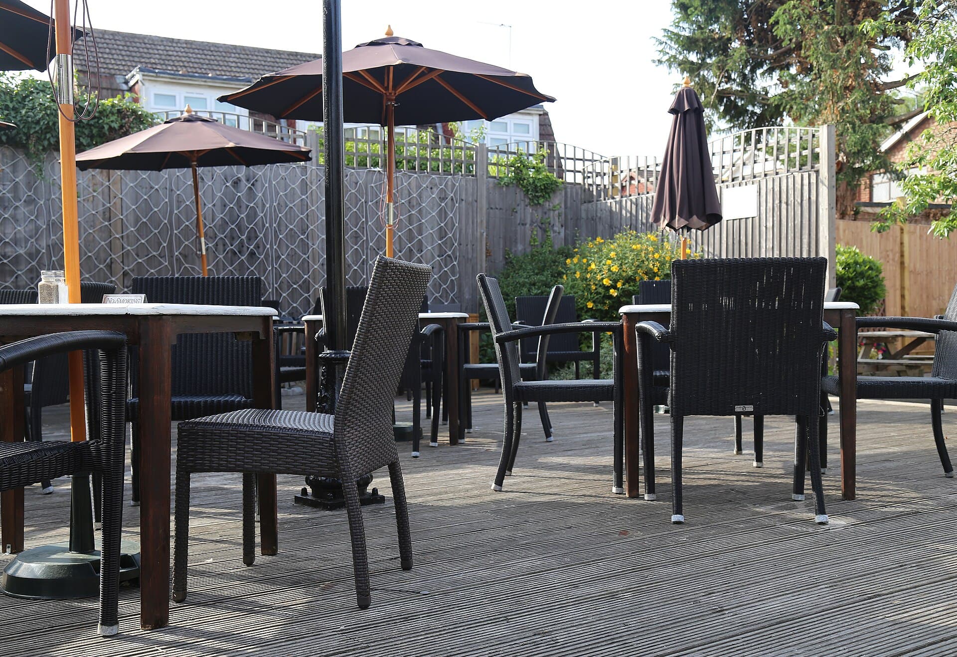Raised timber deck furnished for sitting, the kind of winter-sun platform Melbourne houses actually use.